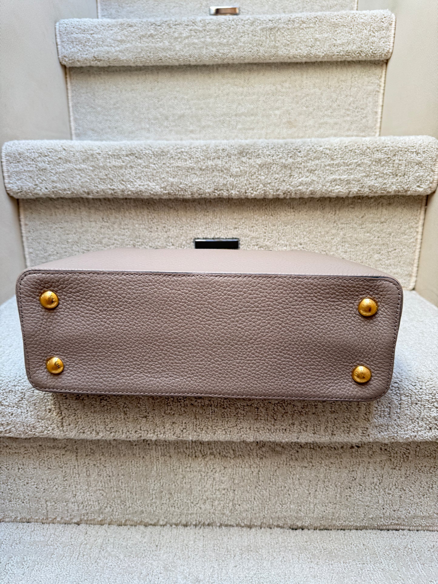 Louis Vuitton Taurillon Capucines PM in Galet or taupe