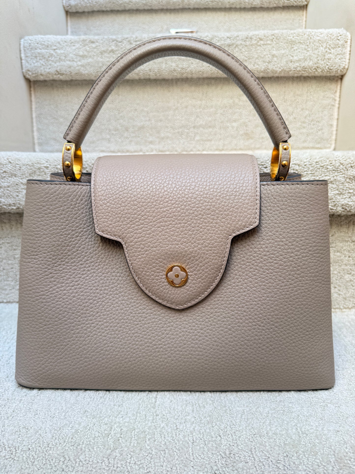 Louis Vuitton Taurillon Capucines PM in Galet or taupe