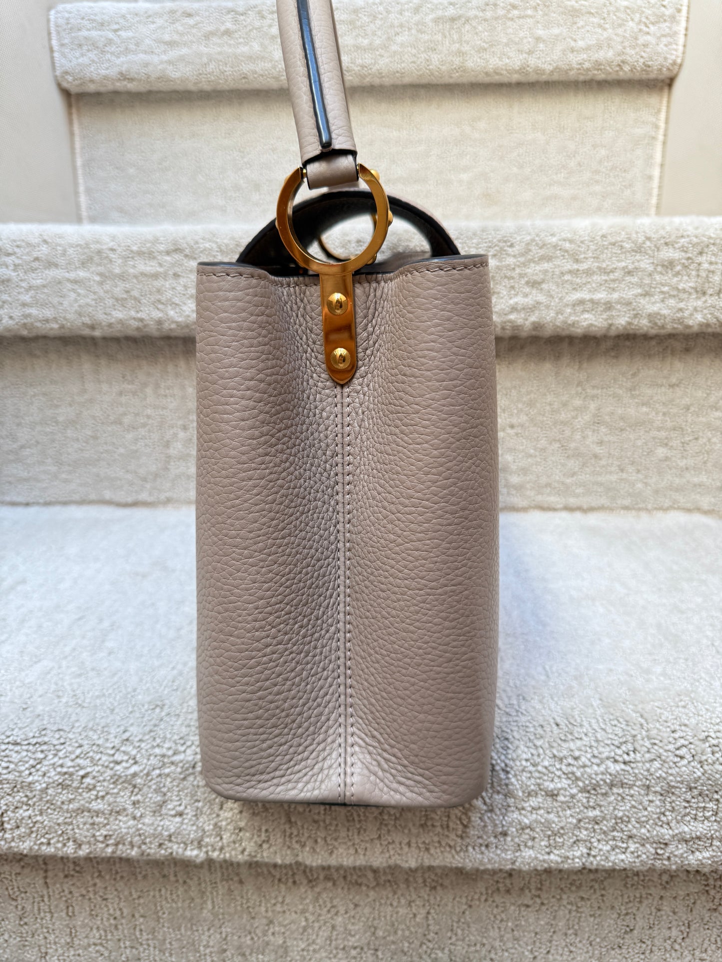 Louis Vuitton Taurillon Capucines PM in Galet or taupe