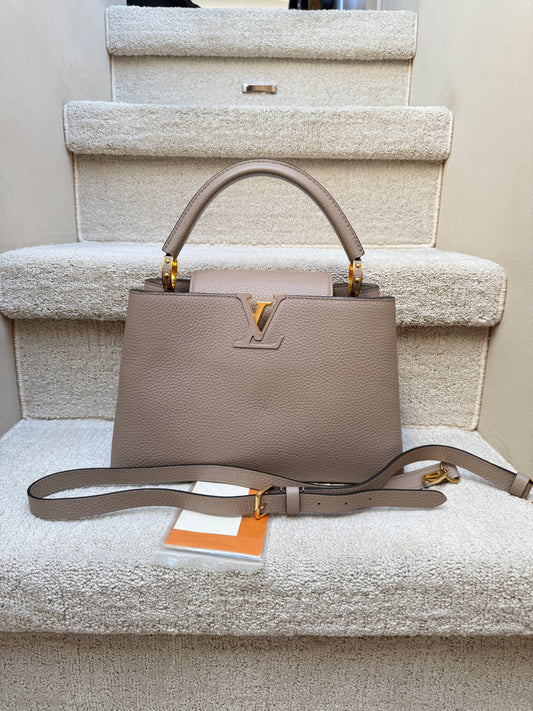 Louis Vuitton Taurillon Capucines PM in Galet or taupe