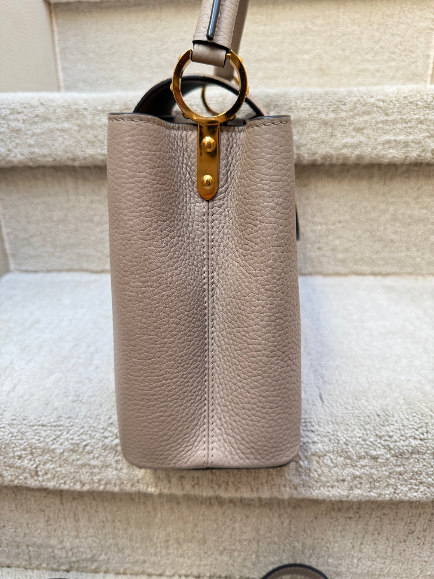 Louis Vuitton Taurillon Capucines PM in Galet or taupe