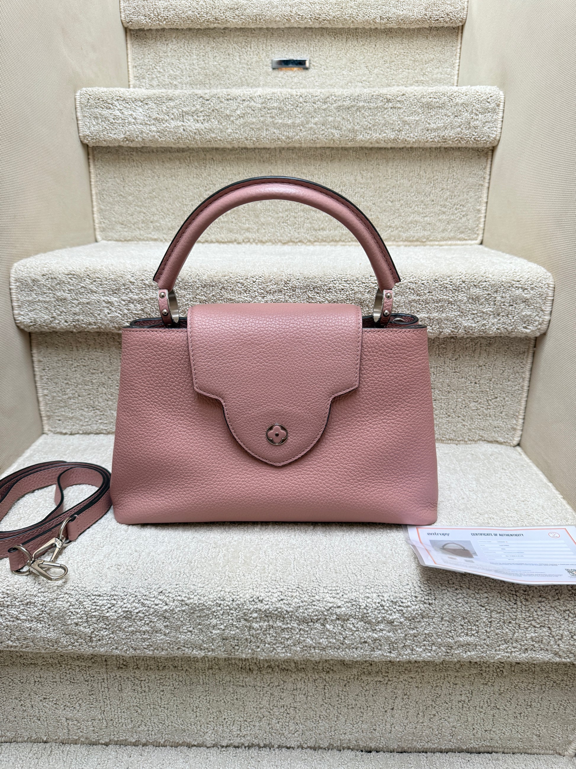 louis vuitton capucines purse in pink view of flower flap outside of bag