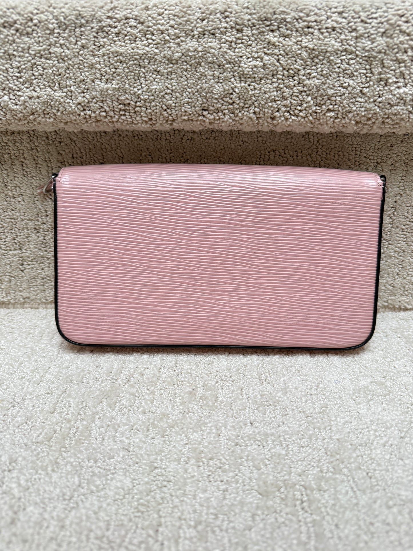 Close up of the back of a felicie pochette offered for sale from purseonalshopper in pink epi leather
