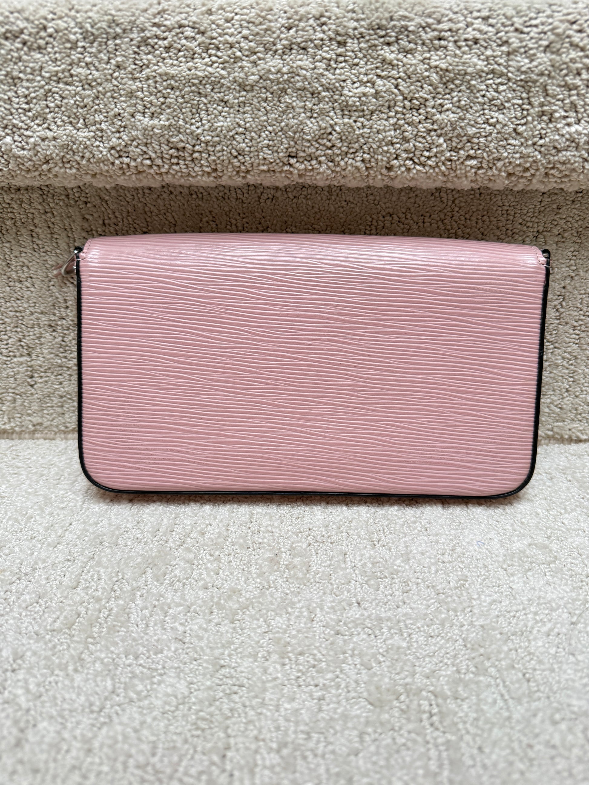 Close up of the back of a felicie pochette offered for sale from purseonalshopper in pink epi leather