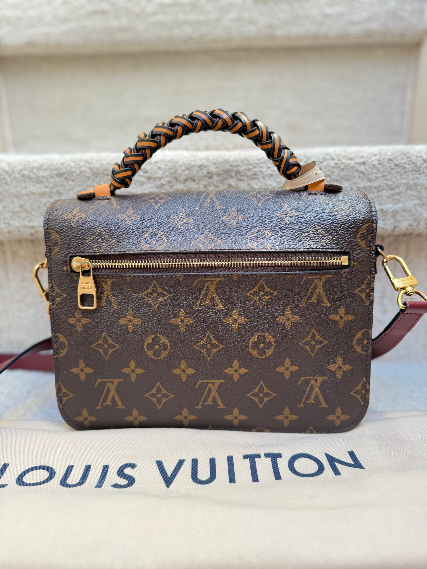 back photo of LV metis pochette in monogram preloved resale like new