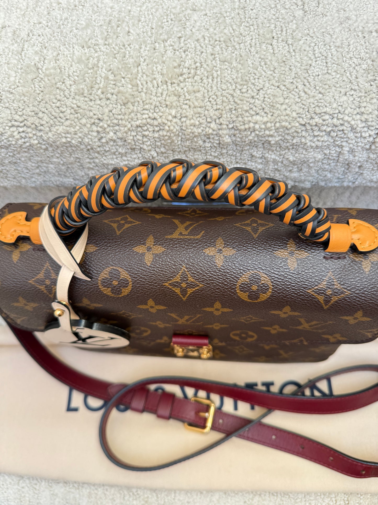 louis vuitton pochette metis special edition with braided handle shown from above