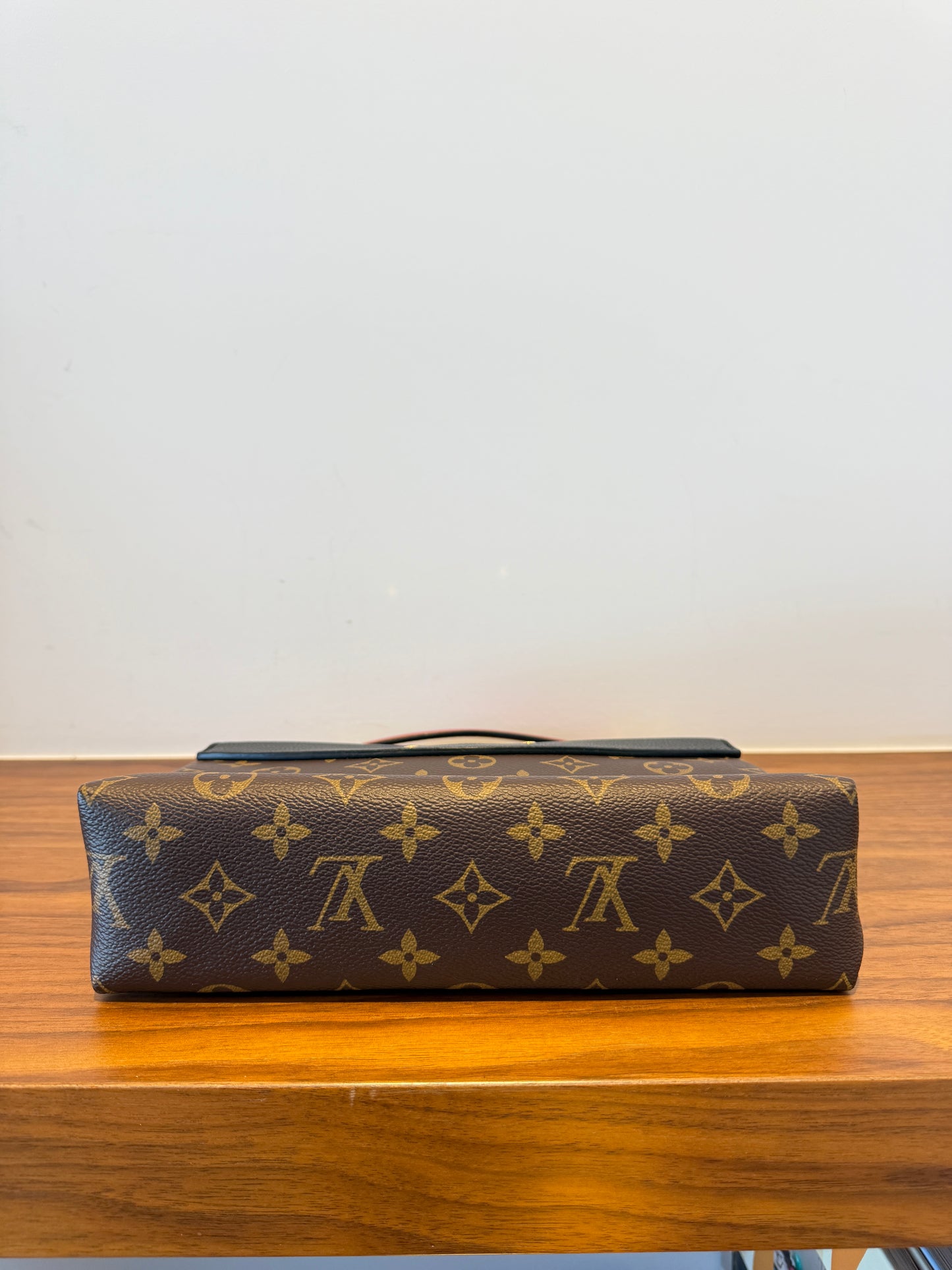 Close up of bottom of louis vuitton saint placide monogram handbag