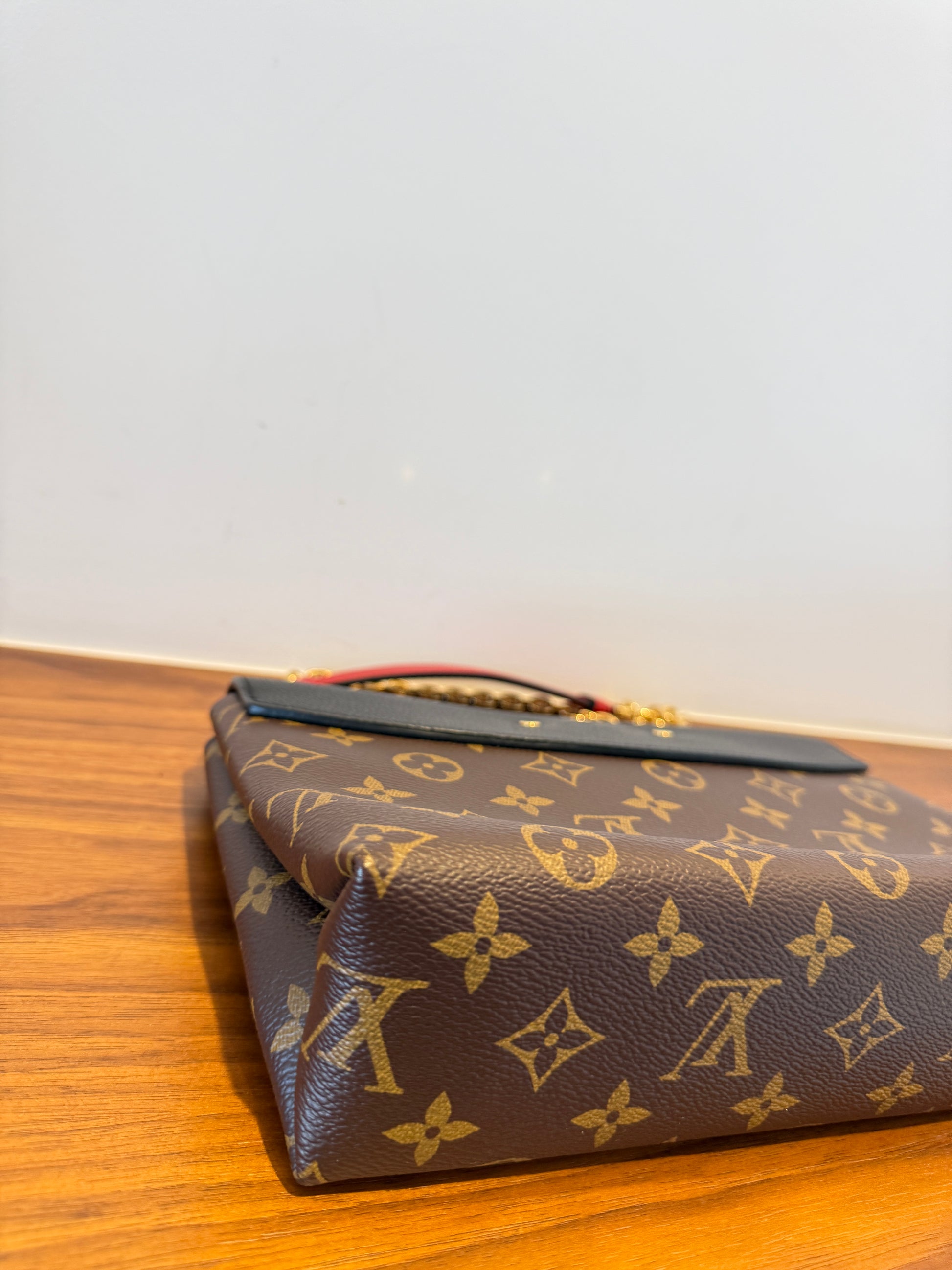 close up of back left corner of louis vuitton saint placide monogram