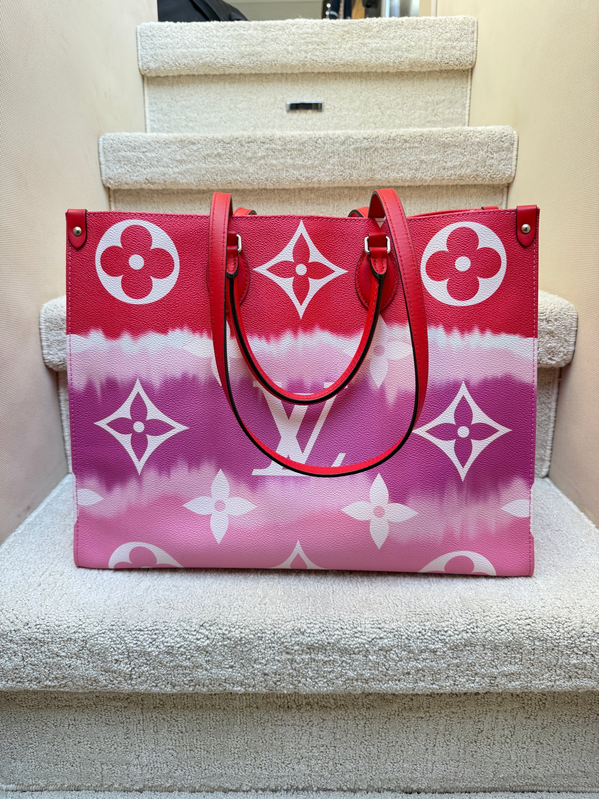 louis vuitton on the go gm tote in pink and red used resale 