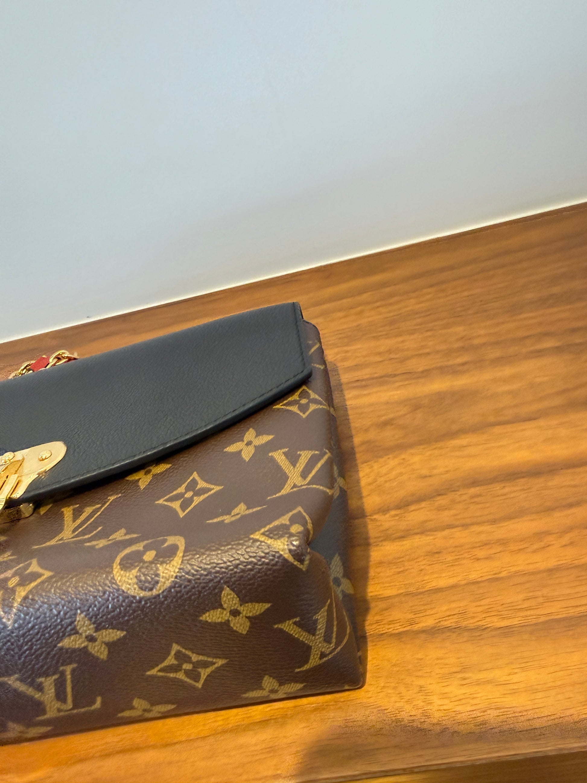close up of front corner of louis vuitton saint placide showing like new preloved condition