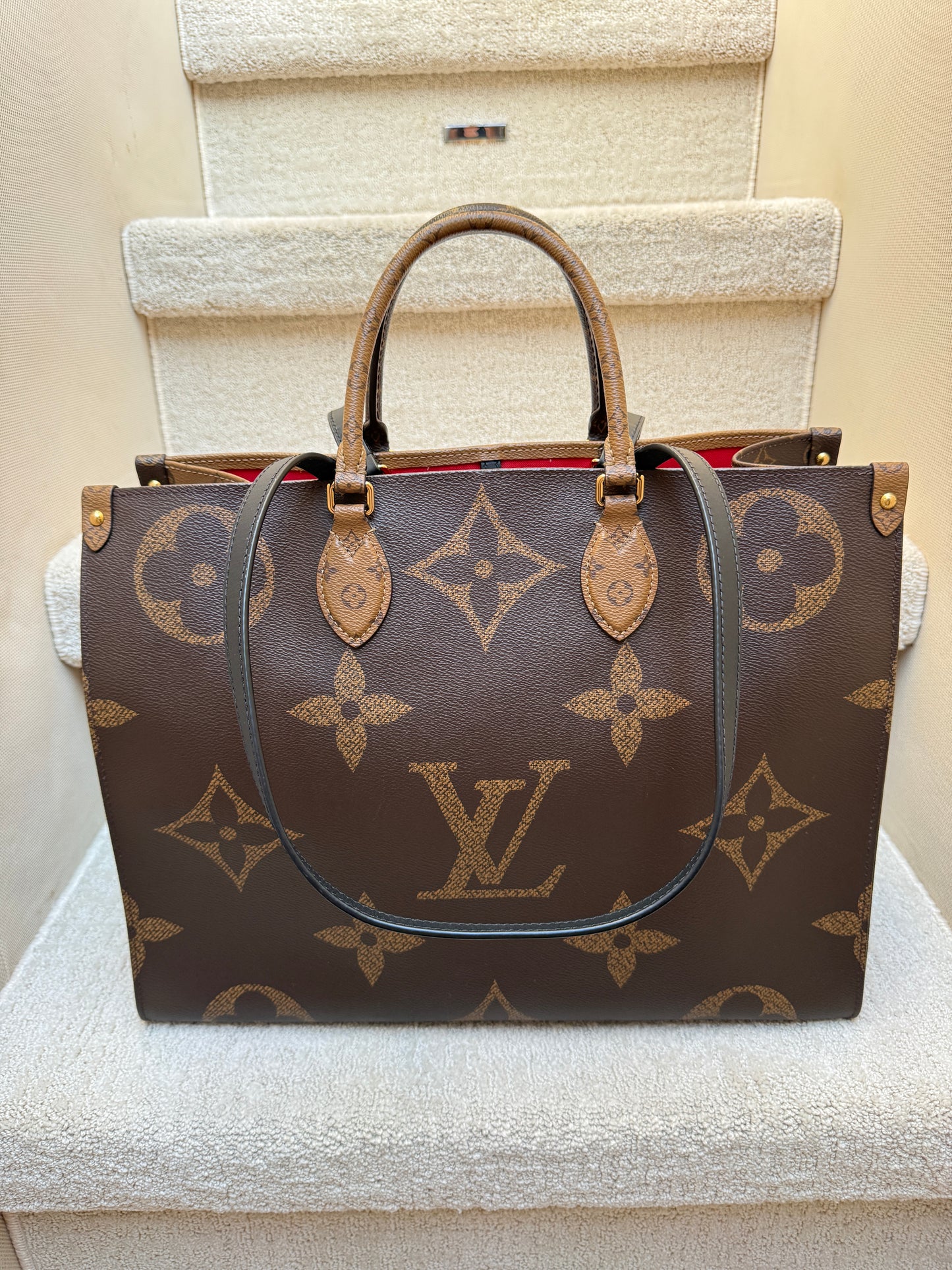 Darker brown side of louis vuitton on the go Tote in GM size authentic and preowned 