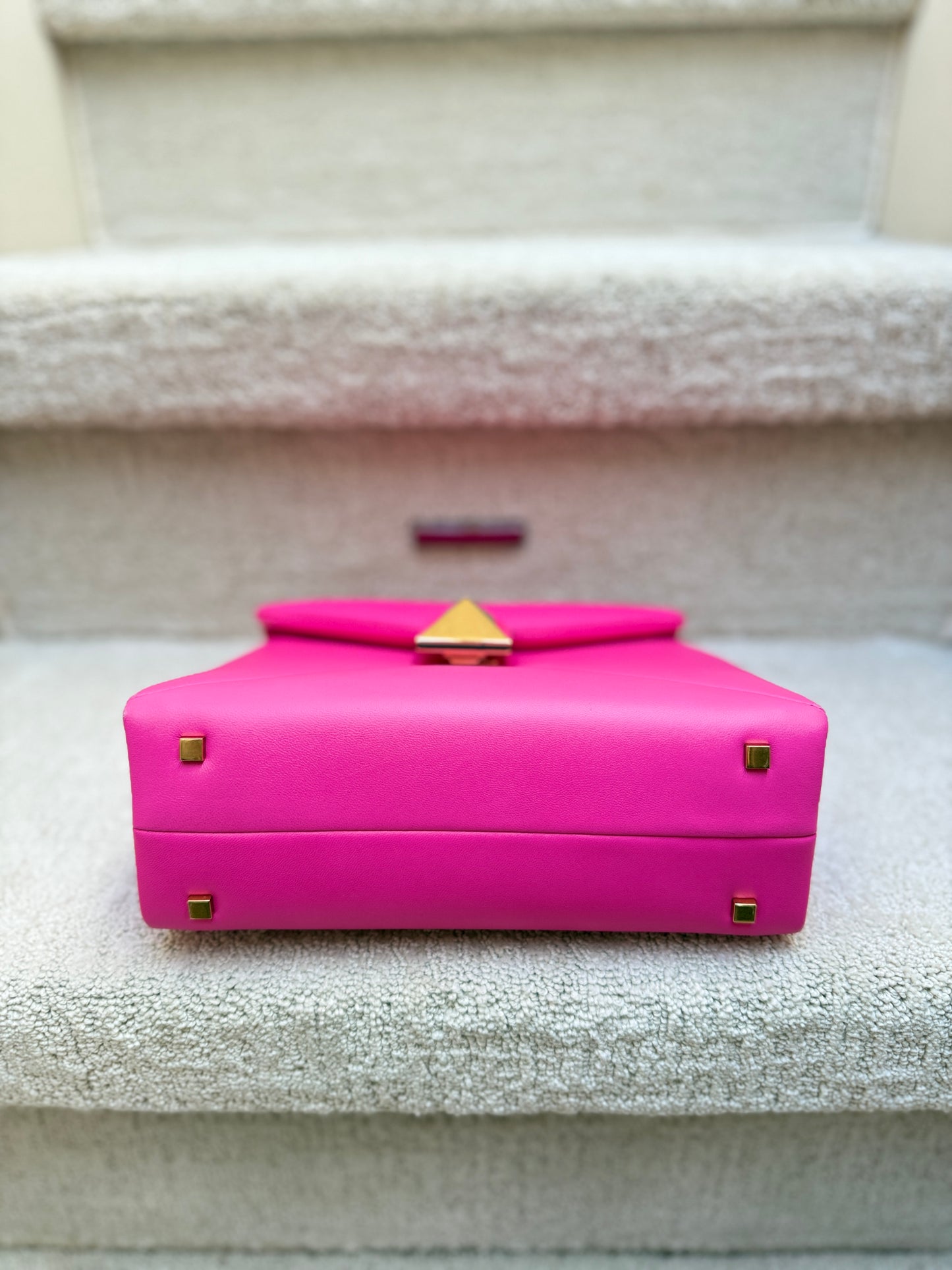 valentino pink purse bottom of bag with feet in gold